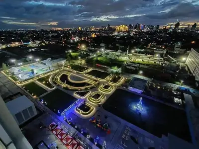 an aerial view of a city at night at Veronica Grey's Staycation 1BR in Manila