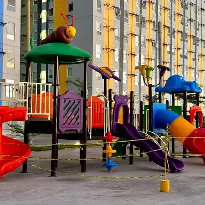 a playground with many different types of play equipment at Veronica Grey's Staycation 1BR in Manila