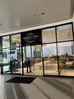 a store front with a sign in a building at Relaxing Pasay Retreat Pool & WiFi - Harlhy in Manila
