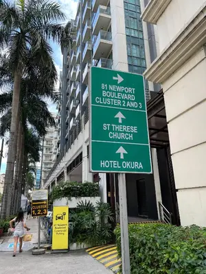 a street sign in front of a hotel at Relaxing Pasay Retreat Pool & WiFi - Harlhy in Manila