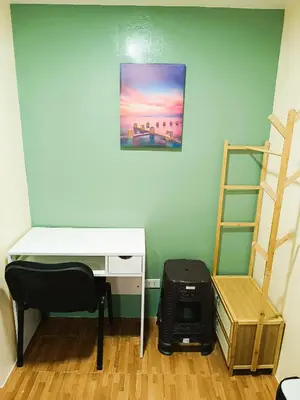a room with a desk and a chair and a ladder at Agate's Loft in Manila