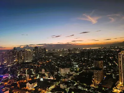 a view of a city skyline at night at Agate's Loft in Manila