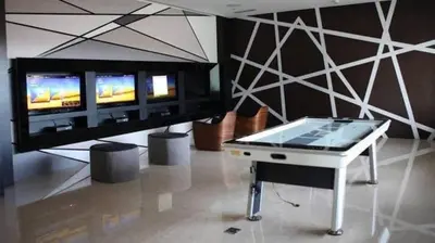 a ping pong table in a room with a tv at Jing'sCrib 2BR Apartment by Azure Near Manila International Airport in Manila