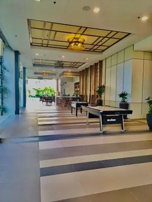 a room with two ping pong tables in a building at Apartment in KAI Garden Residences in Manila