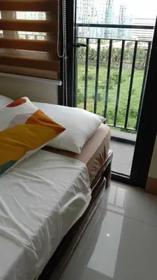 a bedroom with two beds and a large window at Shore 3 Tower 2 near MOA Parking WI-FI Netflix in Manila