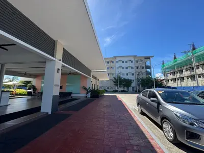 a car parked in front of a building at SMDC Park Residences Unit 202 in Ibaba