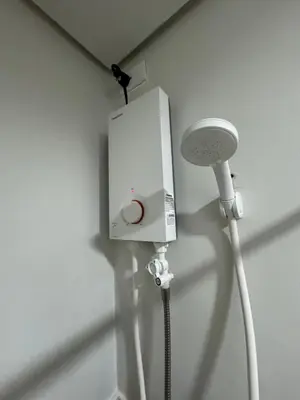 a white speaker and a light on a wall at SMDC Park Residences Unit 202 in Ibaba