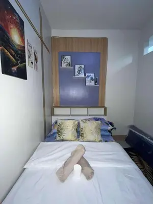a bedroom with a bed with a towel on it at Shore 3 Residences Staycation in Manila