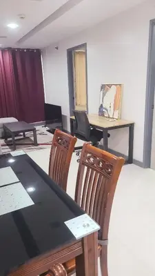 a conference room with a table and chairs at BGC Center Decent 74sqm, 2br, 2baths, 4beds with maid quarter in Manila