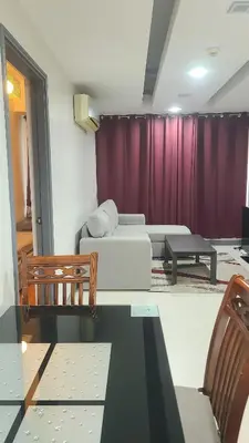 a living room with a couch and a table at BGC Center Decent 74sqm, 2br, 2baths, 4beds with maid quarter in Manila