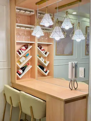 a wine cellar with a bar with chairs and lights at Elegant Staycation Near Mall of Asia with Pool Access in Manila