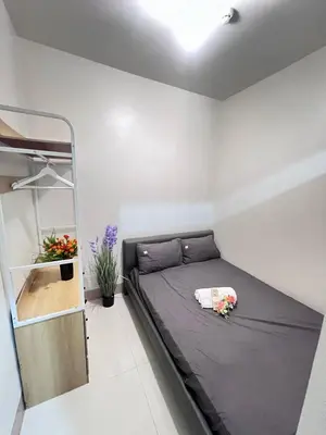 a small bedroom with a bed in a room at UNISTAY Shore 3 Tower 2 14 Flr w Bal in Manila