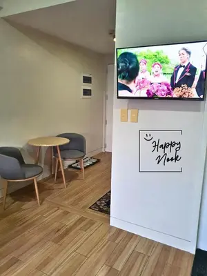 a waiting room with a flat screen tv on a wall at Happy Nook at Holland Park Condominium in Biñan