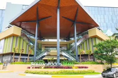 a large building with a staircase in front of it at Happy Nook at Holland Park Condominium in Biñan