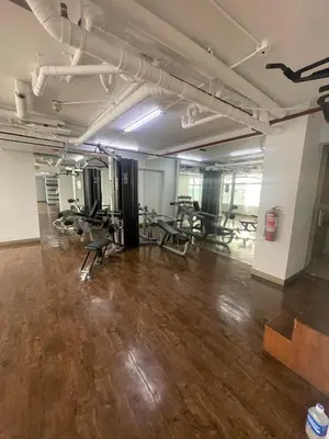 a gym with treadmills and chairs in a room at Antel Spa Residences 2505 in Manila