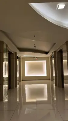 a large room with a large window and a white floor at Shell Residences near MOA and NAIA by Mae in Manila