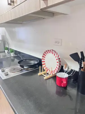 a kitchen counter with a plate and utensils on it at UNISTAY Shore Res w Bal Manila Bay View nr MOA in Manila
