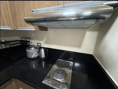 a kitchen with a stove top oven in a kitchen at JRM Staycation The Radiance Manila Bay Sunset with Pay Parking in Manila