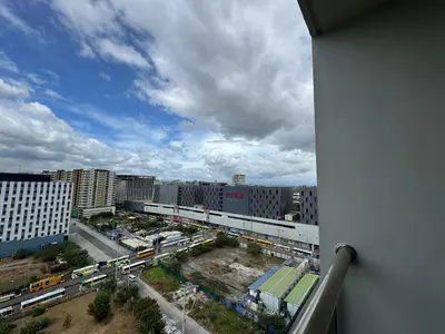 a view of a city with buildings and a train at L CONDOTEL Apartment Near Okada Casino PITX MOA with Pool in Manila