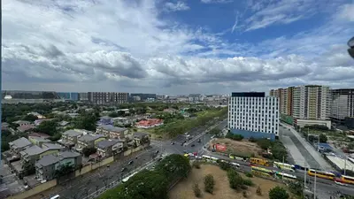 an aerial view of a city with buildings and traffic at L CONDOTEL Apartment Near Okada Casino PITX MOA with Pool in Manila
