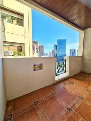 an empty room with a view of a city skyline at 16 Guest for Group at Palm Tower 2 Makati RM 203 in Manila