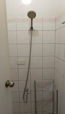 a shower with a shower head in a bathroom at 16 Guest for Group at Palm Tower 2 Makati RM 203 in Manila