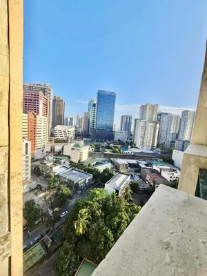 a view of a city with tall buildings at 16 Guest for Group at Palm Tower 2 Makati RM 203 in Manila