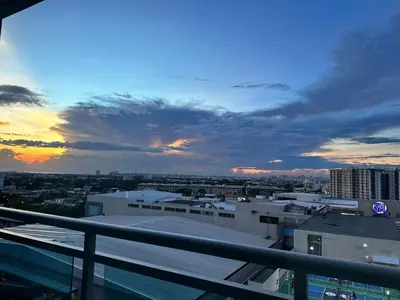 a view of a city at sunset from a building at 1BR Condotel in Azure Urban Resort near NAIA #TRO1 in Manila