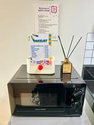 a microwave with a box on top of it at RoVi,s Nook SMDC Charm in Manila