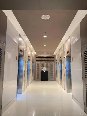 an empty hallway in a building with a hallwayngth at Hannah's Crib at Shore Residences with Balcony and Pool View in Manila