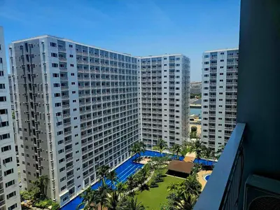 an aerial view of a large apartment building with a pool at Hannah's Crib at Shore Residences with Balcony and Pool View in Manila