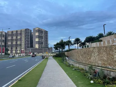 a city street with tall buildings and a sidewalk at Lovely 2br near Airport, Solaire, & Okada - 6pax in Manila