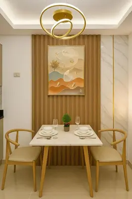 a dining room with a table and chairs and a chandelier at Stylish & Cozy 1 bedroom near Mall of Asia in Manila