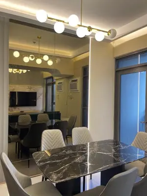 a conference room with a table and chairs at Lovely 2 bedroom near Airport & Okada in Manila