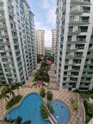 a view of some apartment buildings and a swimming pool at Your 2BR within Pasay in Manila