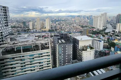 a view of a city from the top of a building at Green City View Apt in Gramercy Unit 3502 Makati w Netflix in Manila
