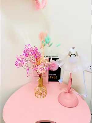 a pink table with two vases of flowers on it at Boogsh Coquette Vibes Staycation In Pasig! in Manila