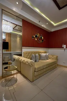 a living room with a couch and a table at Shore 2 Reminisce in Manila