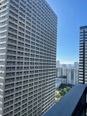 a view of a tall building in a city at Rejuvenate at Fame Residences Mandaluyong SM MegaMall in Manila