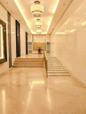 a large hallway with stairs and a stair case at Rejuvenate at Fame Residences Mandaluyong SM MegaMall in Manila