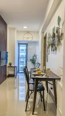 a kitchen and dining room with a table and chairs at Rejuvenate at Fame Residences Mandaluyong SM MegaMall in Manila