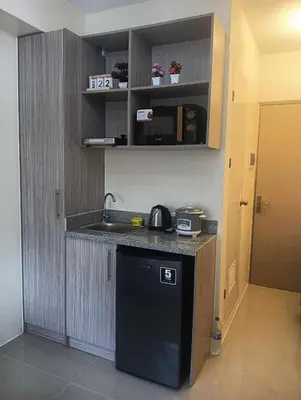a kitchen with a sink and a counter top at Deca Cubao Tower Budget Condo by Ashti in Manila