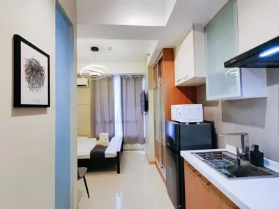 a small kitchen with a sink and a room at 1BR Condotel Suite at Sunshine100 City Plaza #SS03-1 in Manila