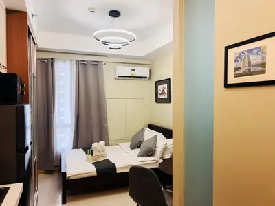 a small room with a bed and a window at 1BR Condotel Suite at Sunshine100 City Plaza #SS04-1 in Manila