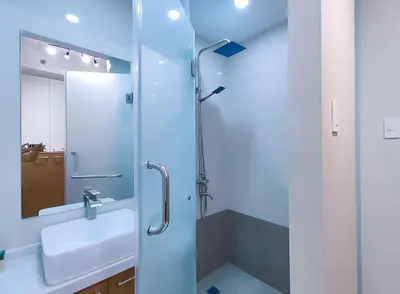 a bathroom with a sink and a shower at 1BR Condotel Suite at Sunshine100 City Plaza #SS04-1 in Manila