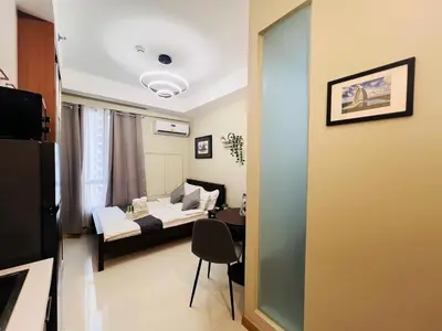 a living room with a couch and a table at 1BR Condotel Suite at Sunshine100 City Plaza #SS04-1 in Manila