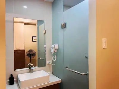 a bathroom with a sink and a mirror at 1BR Condotel Suite at Sunshine100 City Plaza #SS05-1 in Manila