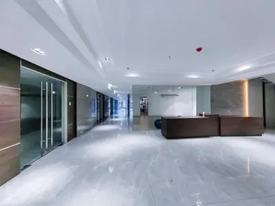 an empty lobby with a desk in a building at 1BR Condotel Suite at Sunshine100 City Plaza #SS05-1 in Manila