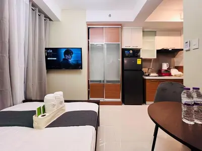 a living room with a kitchen and a dining table at 1BR Condotel Suite at Sunshine100 City Plaza #SS06-1 in Manila