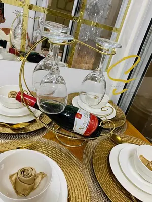 a table with two wine glasses and plates on it at Azure staycation by scarlet suites in Manila